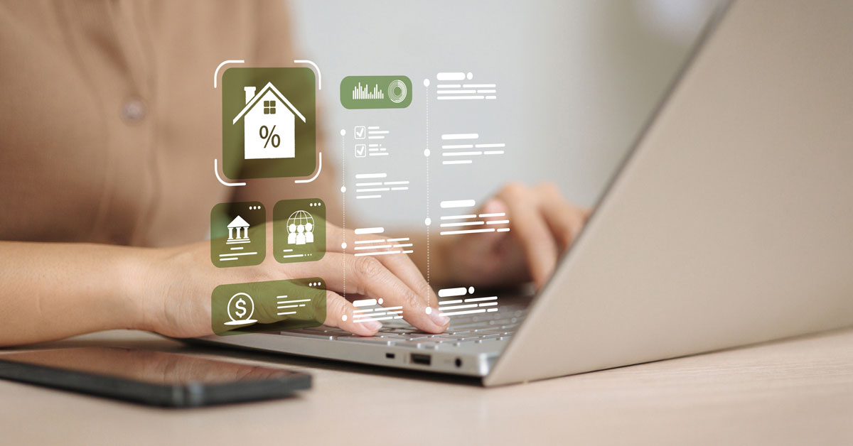 A person types on a laptop with a smartphone nearby as floating home, savings, and analytics icons suggest online banking and financial planning.