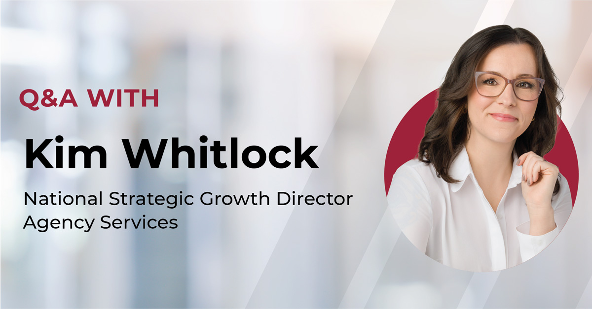 Q&A with National Strategic Growth Director. Professional woman in glasses and white blouse, smiling confidently, in an office-themed background.