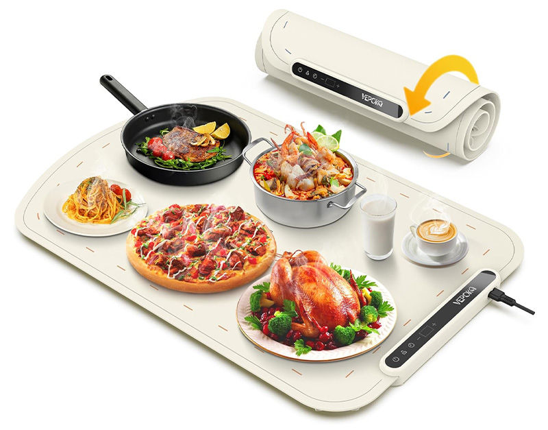 A portable, flexible, rollable food warming mat or tray holding a variety of hot meals like roasted chicken, pizza, paella, steak, and pasta, demonstrating its function as a stylish countertop or serving food warmer.