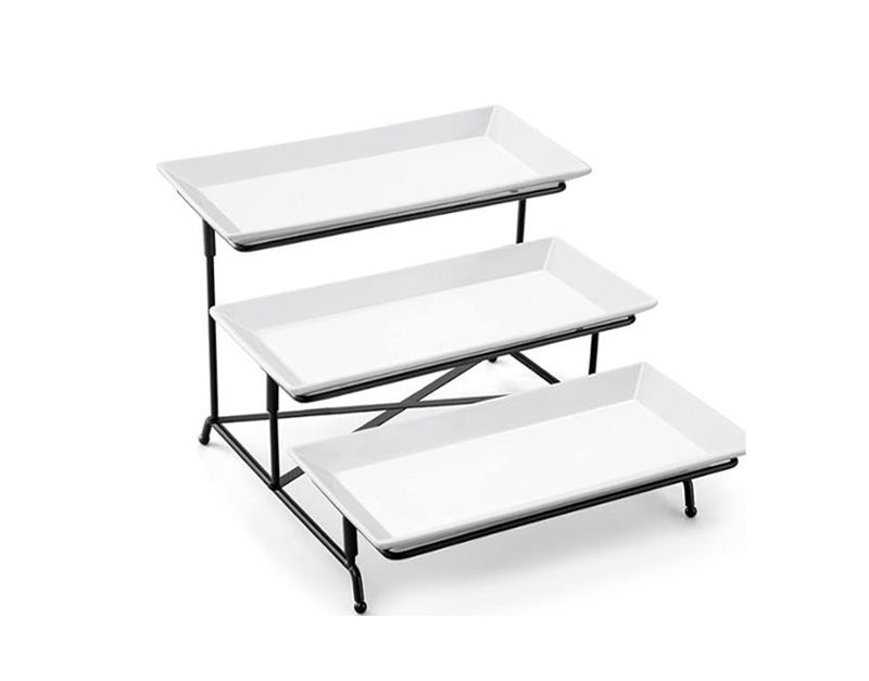A black, metal-framed, three-tier buffet or dessert stand holding three rectangular white ceramic serving platters, ideal for displaying appetizers or pastries.
