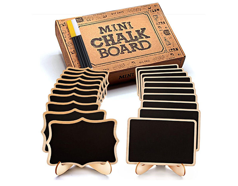 A retail box of 'Mini Chalk Board' signs, containing two styles of small, rectangular and scrolled-edge black chalkboards on wooden easels, and a chalk marker, perfect for place cards, food labeling, or wedding decorations.