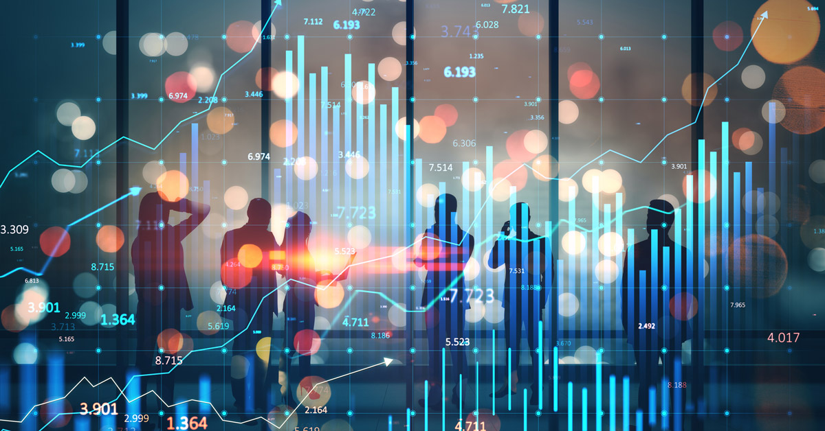 Silhouettes of people against a backdrop of colorful financial graphs and lights, conveying a dynamic, analytical business environment.