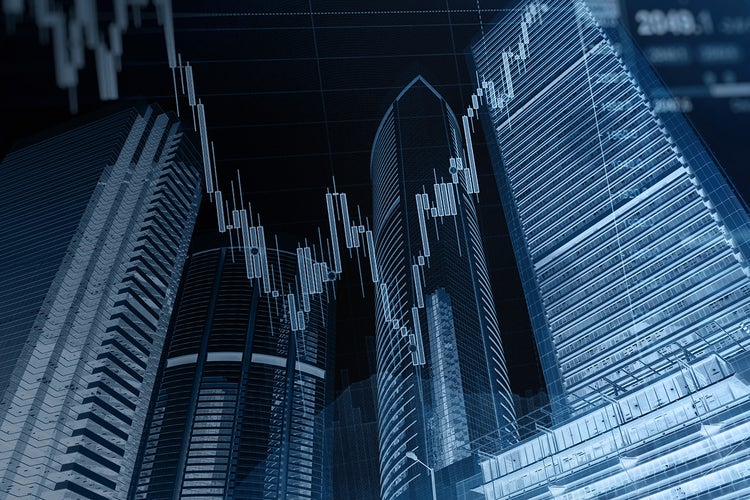 Commercial skyline with graphs has economic undertones