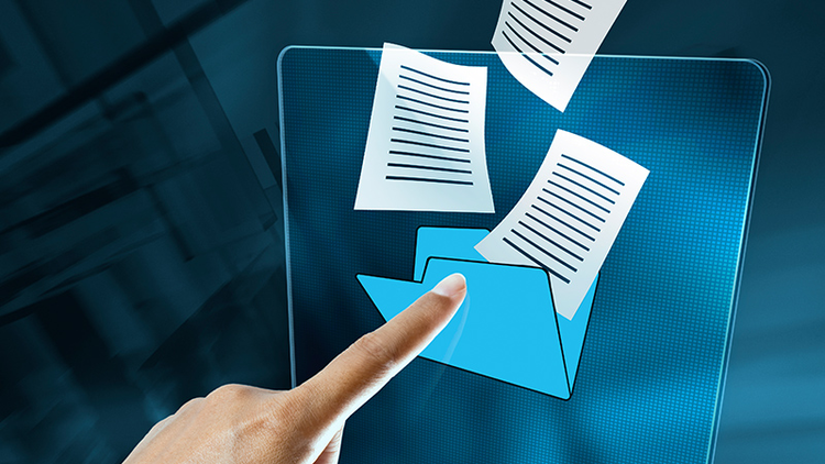 Hand touching a holographic digital file with documents flying out.