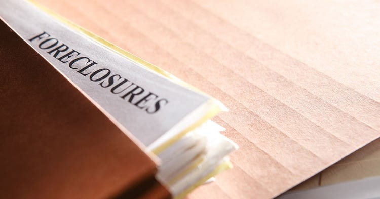Brown pocket file folder with foreclosure documents.