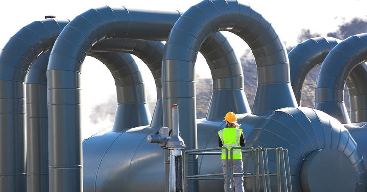 Female engineer inspecats a geothermal powerplant