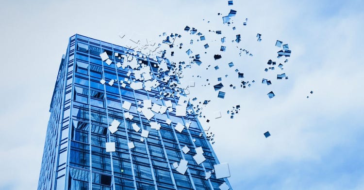 Blue high-rise glass building with pixelated falling fragments