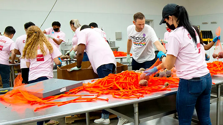 Stewart volunteers at prepare groceries the Houston Area Food Bank