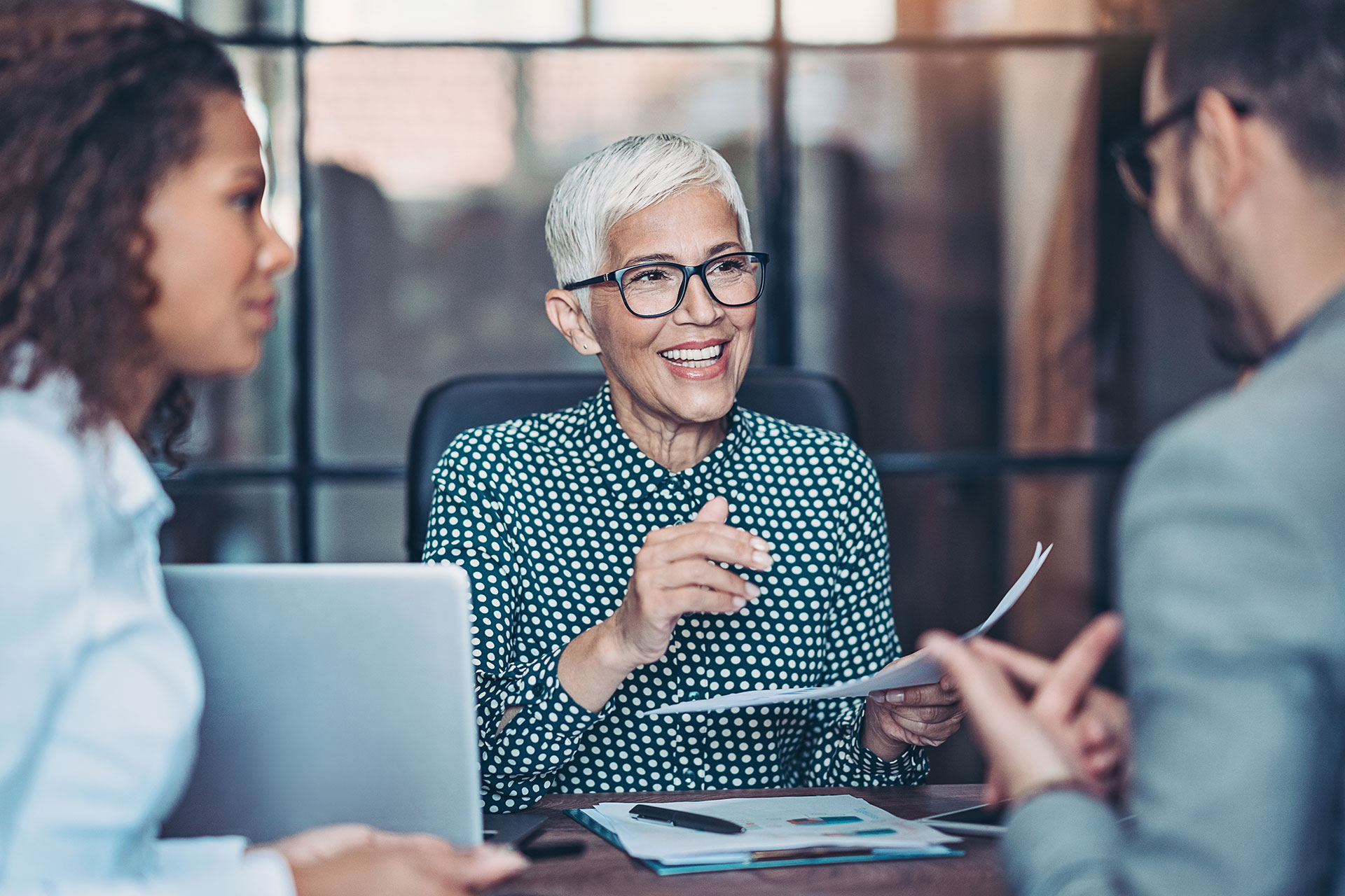 Prefessional business woman connects with customers in office